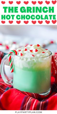 the grinch hot chocolate is in a mug with candy canes on it and text overlay