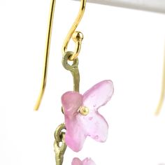 Handmade in USA Cast bronze leaves Cast pink glass flowers Gold filled french ear wires Earrings measure 1.75" long ABOUT GOLDMAKERS Goldmakers Jewelry creates and curates a comprehensive selection of artfully designed hand-crafted jewelry. We aspire to offer the jewelry enthusiast access to affordable classics as well as fresh innovative designs. ABOUT SILVER SEASONS Silver Seasons Jewelry collection is brought to you by designer Michael Michaud. Known for his nature-inspired metal work, Michau Leaf Necklaces, Ring Icon, Michael Michaud, Chevron Earrings, French Wire Earrings, Chevron Necklace, Artfully Designed, Pink Hydrangea, Chevron Ring