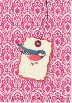 a card with a bird on it and a tag attached to the front of it