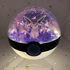 a close up of a pokemon ball on a table