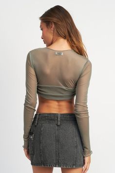 This Crew Neck Ruched Bust Crop Top is made of 95% polyester and 5% spandex for a comfortable stretch that is also durable. The fabric is lightweight and breathable, perfect for any activity. This top is both stylish and practical. SIZE & FIT : MODEL WEARS SIZE SMALLMODEL'S HEIGHT 5'9 Made In: USA Fabric Contents: 95% POLYESTER, 5% SPANDEX Curves And Confidence, Mesh Long Sleeve, Sheer Fabric, Sheer Top, Matching Dresses, Sheer Fabrics, Comfortable Fashion, Long Sleeve Crop Top, Trend Setter