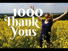 a woman standing in a field with her arms up and the words, thank you