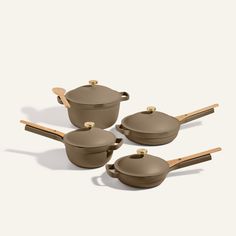 four pots and two pans with wooden handles on a white background, set of three