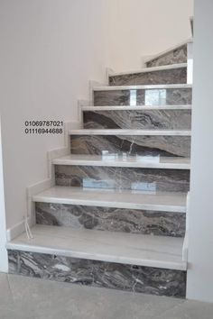 marble stairs in an empty room with white walls