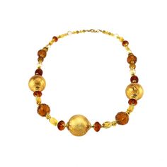 The talents of the Murano Glass Masters are brought to life in this hand blown glass bead necklace.  This exquisite necklace, 27" length, offers a stunning display of design with a combination of amber and gold glass beads.  Combining the perfect mix of traditional Murano Glass elegance and modern styled jewelry design creates an elegant addition to any jewelry collection.  Each necklace is ready to ship in a gold jewelry gift box tied with a gold cord.  A Murano Glass Certificate of Authenticity is included with each piece.  A Murano Glass Necklace is the perfect gift idea for her for any occasion such as Birthdays, Anniversaries, Valentine's Day and Mother's Day.  Gift messaging available. It's also the special final touch to complement any outfit.  As each necklace is individually hand Styled Jewelry, Murano Glass Necklaces, Gold Jewelry Gift, Final Touch, Gold Glass, Glass Bead Necklace, Glass Necklace, Jewelry Gift Box, Hand Blown Glass