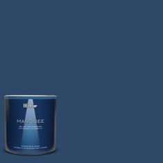 a can of marquee paint on a green background