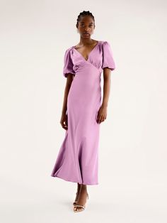 In a mood-boosting shade of Lavender, Rosie is as effortless as she is elegant. Short balloon sleeves playfully draped in our signature recycled satin add a twist of texture to this classic neckline. Maxi in length and bra-friendly, she’s the perfect bridesmaid, wedding guest or date night dress. Rosie is the dress that does it all. Lilac Bridesmaid Dresses With Sleeves, Dress Lilac, Date Night Dress, Puff Sleeve Dress, Bridesmaid Wedding, Satin Maxi, Date Night Dresses, Satin Maxi Dress, Puffed Sleeves Dress