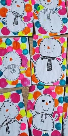 four snowmen are painted on paper with polka dots