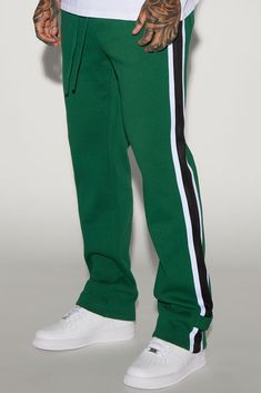 Available In Green. Elastic Waist With Drawstring Side Hand Pockets Back Pockets Side Panel Detail 80% Cotton 20% Polyester Imported | Mens Brantley Straight Sweatpant in Green size Large by Fashion Nova Green Sweatpants With Side Stripes For Streetwear, Green Bottoms With Side Stripes For Streetwear, Green Streetwear Pants With Side Stripes, Green Pants With Side Stripes For Streetwear, Green Side Stripe Pants For Streetwear, Casual Green Bottoms With Three Stripes, Green Sweatpants With Drawstring, Green Sportswear Bottoms With Three Stripes, Cotton Joggers With Side Stripes