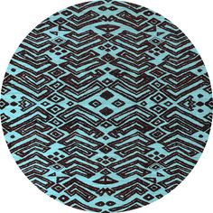 a round rug with blue and green designs on it