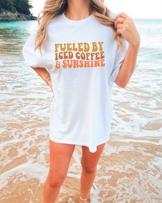 Fueled by Coffee & Sunshine Comfort Colors Tee | Beach Tshirt | Oversized Summer Tee | Trendy Beach Clothes DETAILS: Comfort Colors 1717 SIZES: Small-2X SIZE GUIDELINES: This Comfort Colors Shirt is a unisex fit that runs TRUE to size! If you want this to be comfortably fitted (NOT oversized), I recommend sticking with your regular size! -If you want it to fit slightly oversized, I recommend sizing up 1 size! -If you want it to fit very oversized (like the pictures), I recommend sizing up 2-3 sizes! Please allow 3-8 business days processing time for your item to be handmade just for YOU! All orders will ship via either USPS or UPS from Louisiana. Relaxed White Tops For Vacation, Relaxed Short Sleeve Tops For Beach Season, Relaxed White Beach Top, Relaxed White T-shirt With Letter Print, Relaxed Summer Tops With Screen Print, Relaxed White T-shirt For Day Out, Summer Tops For Vacation Loungewear, White Tops For Vacation Loungewear, White Tops For Loungewear On Vacation