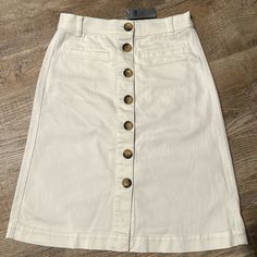 Anne Taylor - Petite Button Front Denim Skirt In White Wash. With A Cool Button Front, This Denim Skirt Is A Fresh Take On A Forever Essential. Belt Loops. Four-Pocket Styling. Length: 22” Long Fabric & Care 98% Cotton, 2% Spandex Machine Washable Condition: New With Tag. Smoke Free Home. Fast Shipping. Bundle 2 Or More Items From My Closet For An Extra 10% Discount And Saving On Shipping Cost. Thank You For Checking Out My Closet! Chic Button-up Denim Skirt, Chic Button-up Denim Skirt With Buttons, Fitted Cotton Skirt With Buttoned Pockets, Spring Button-up Denim Skirt For Workwear, Spring Denim Skirt With Buttons, Summer Workwear Denim Skirt With Button Closure, Trendy Buttoned Cotton Denim Skirt, Button-up Cotton Denim Skirt With Pockets, High Rise Cotton Denim Skirt With Button Closure