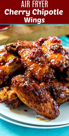 air fryer cherry chipotie wings on a white plate with text overlay