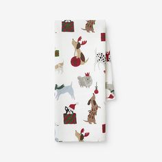 two napkins with dogs and christmas decorations on them, one has a white background