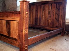 a bed frame made out of wood with no headboard and foot board on the floor