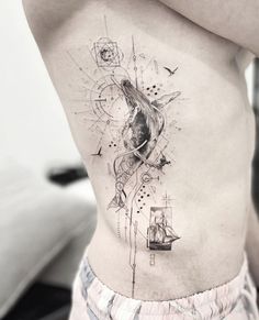 a man's stomach with an abstract design on it and a ship in the background