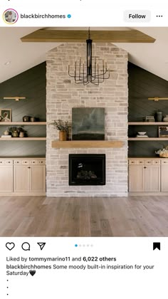 an instagramted photo of a living room with fireplace and built - in bookshelves