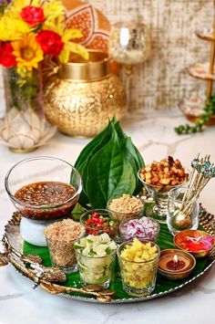 a platter filled with lots of food on top of a table