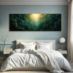 a large painting hanging above a bed in a bedroom