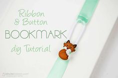 a bookmark with a fox on it and ribbon attached to the back of it