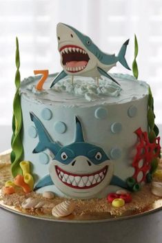 a birthday cake decorated with an image of a shark