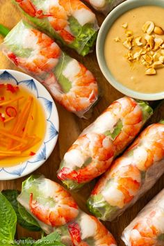 a tray of Vietnamese summer rolls with two dipping sauces on the side: nuoc cham and peanut sauce Shrimp Vermicelli, Summer Rolls With Peanut Sauce, Vietnamese Fresh Spring Rolls, Vietnamese Spring Rolls Recipe, Poached Shrimp, Healthy Spring Rolls, Vietnamese Summer Rolls, Shrimp Spring Rolls, Vietnamese Spring Rolls