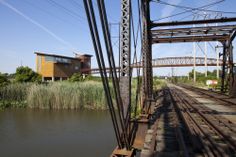 an old train track crossing over a body of water