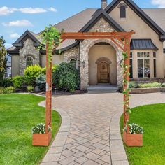 a house with a walkway leading to the front door