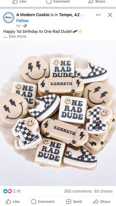 some cookies that are on a plate with the words happy 1st birthday to one rad dude