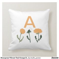 a pillow with flowers and the letter a on it