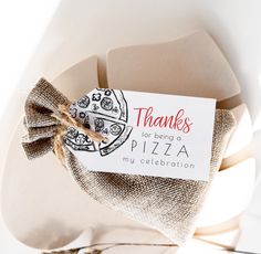 there is a thank card on top of a pizza box with burlap and twine