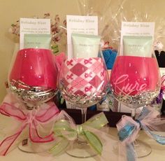 three wine goblets with personalized labels on them sitting on top of a table