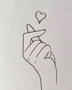 a drawing of a hand holding a heart