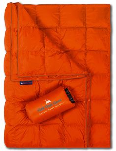 an orange sleeping bag with a cup on it