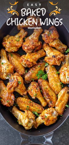 baked chicken wings in a skillet with parsley on top and the words, easy baked