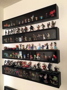 the shelves are filled with action figures and figurines