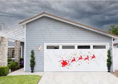 a garage decorated with santa's sleighs and stars on the side