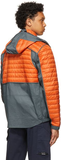 Long sleeve paneled down-filled quilted nylon satin and crinkled nylon taffeta jacket colorblocked in orange and grey. Press-stud throat guard at detachable hood. Concealed zip closure with press-stud placket at front. Zippered pockets at waist. Elasticized cuffs. Partially elasticized shirttail hem. Partial nylon taffeta lining. Logo-engraved black and silver-tone hardware. Part of the 5 Moncler Craig Green collection. Supplier color: Multicolor Fill: 90% pure goose down, 10% feathers. Moncler Runway, Craig Green Moncler, Moncler Sweatshirt, Taffeta Jacket, Moncler Trailgrip, Moncler Genius, Craig Green, Luxury Nylon Puffer Jacket With Double-lined Hood, Green Collection