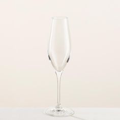 a wine glass sitting on top of a table