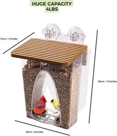 a bird feeder with two birds in it and the measurements for each one on top