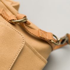 We perfected all the details on this apron bag. Hand-made from eco-friendly canvas, this bag is durable and designed to last. The longer you use it, the better it looks. This apron keeps your work tools secure and organized while you work. We made the side pockets detachable, allowing you to remove them if you do not intend to use a hand pump or lint remover. Wide, natural straps for comfort while hung around your waist. Waist straps are adjustable and go up to 45". A large front pocket holds yo Expensive Party, Utility Apron, Utility Bag, Lint Remover, Work Tools, Hand Pump, Neutral Beige, Beige Color, Party Planning