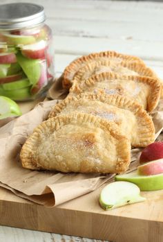 three apple hand pies sitting on top of a table