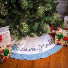 two wrapped presents under a christmas tree