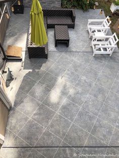 an overhead view of a patio with chairs and tables