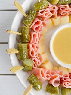 a white plate topped with different types of appetizers