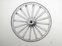 a drawing of a wheel on a white wall