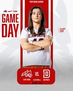 a woman is standing in front of a red and white card with the name game day on it