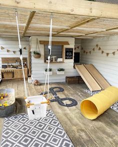 an outdoor play area with swings and slides