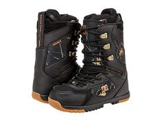 a pair of black boots with gold details on the outstep and side zippers