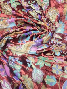 the fabric is very colorful and has flowers on it